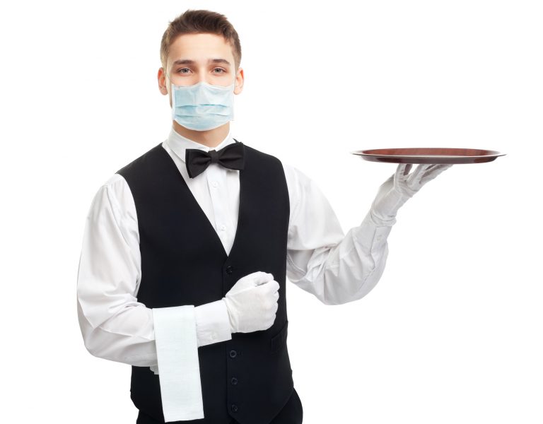 Young smiling waiter with empty tray Portrait of young happy smiling waiter with empty tray isolated on white background