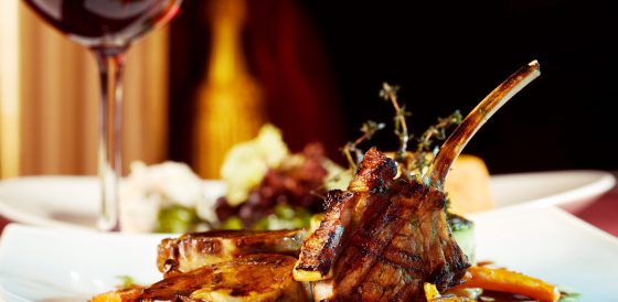 luxury dinner served on  the table with glass of red wine